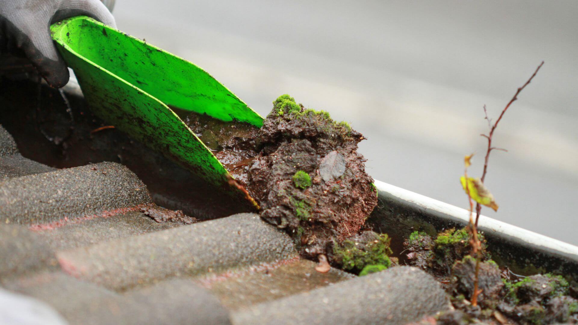 A Gutter Scoop to Remove Debris