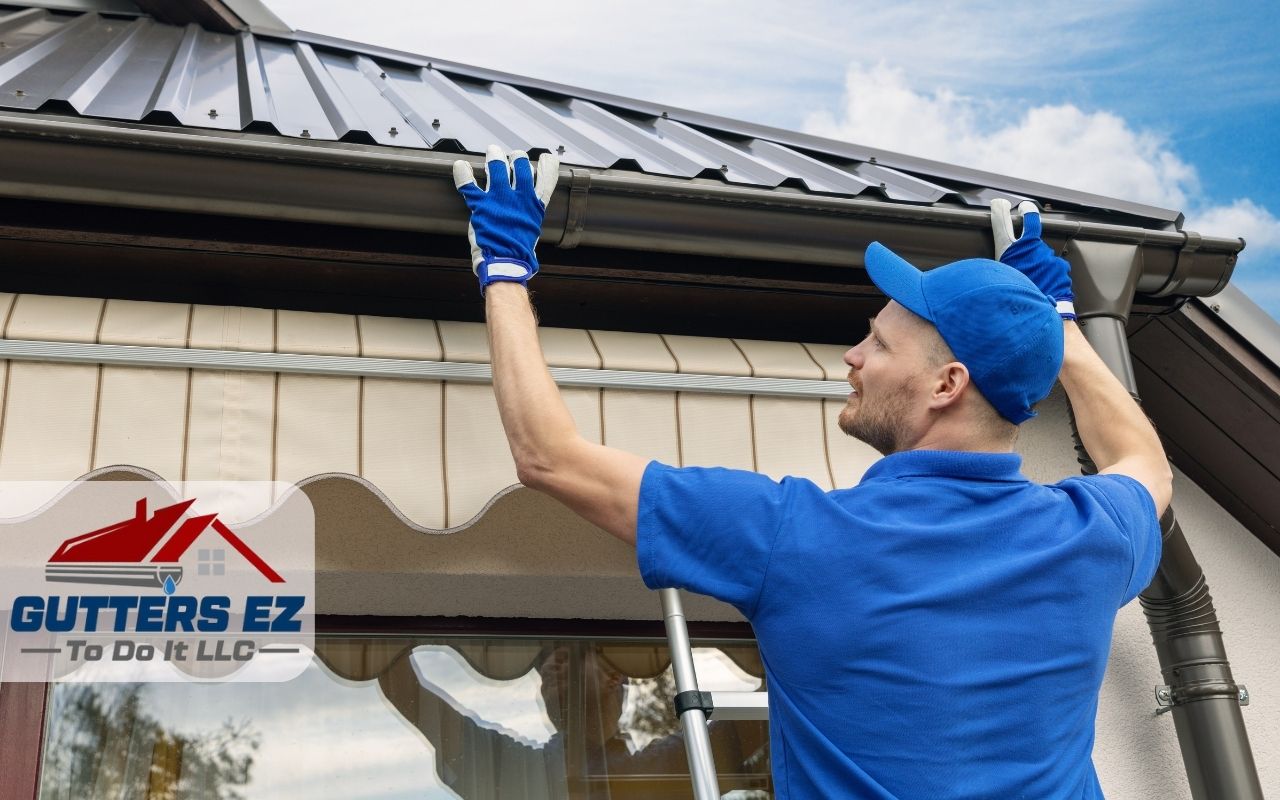 Gutters Ez To Do It LLC professionals installing new gutters