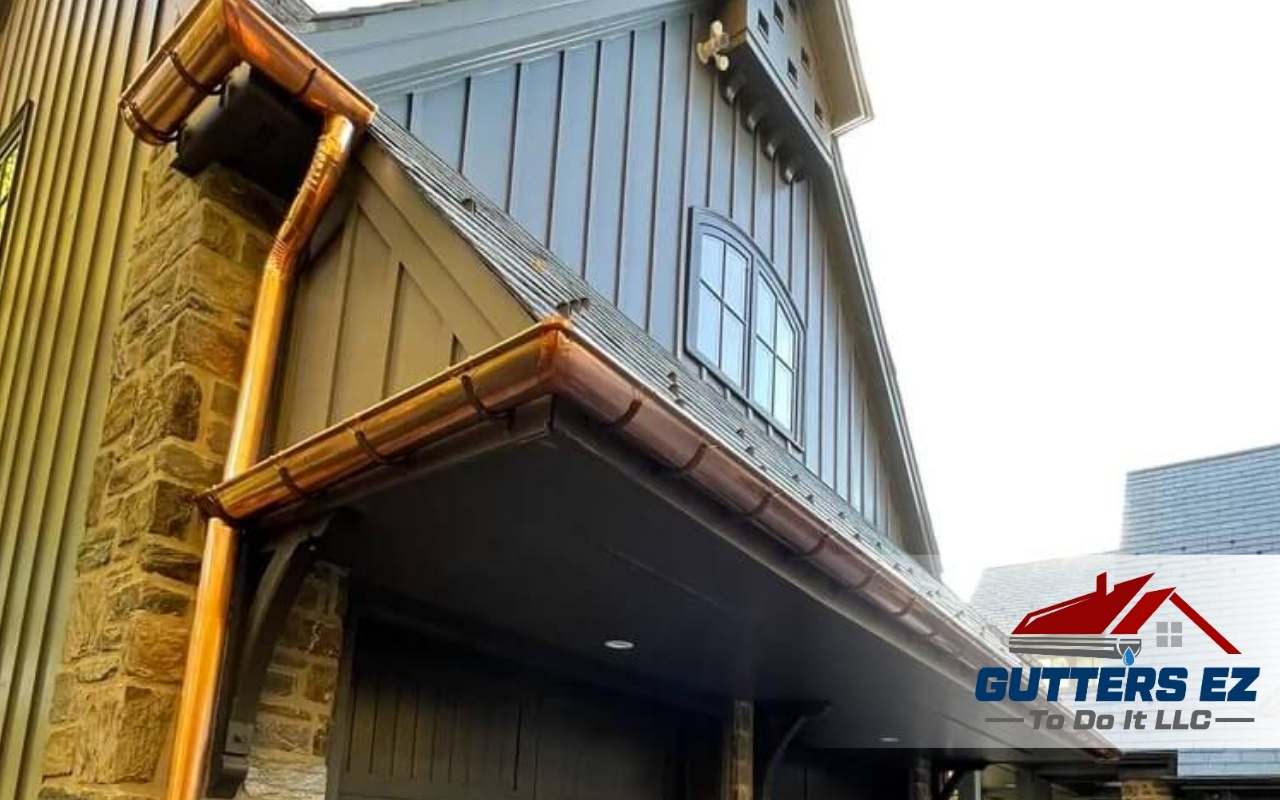 Close-up of a technician repairing copper gutters on a historic home.