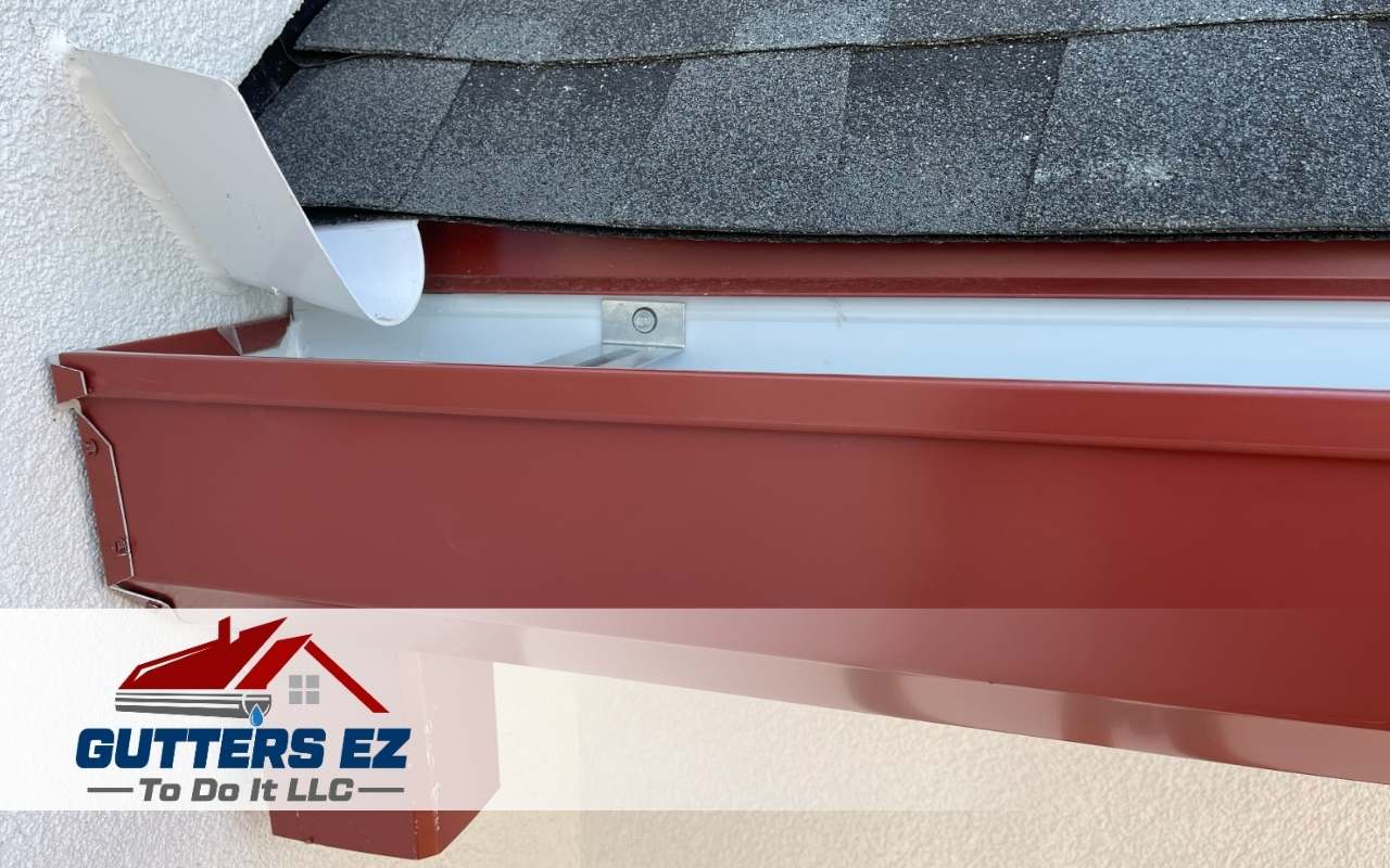 A technician inspecting a home’s gutter system before providing replacement recommendations.