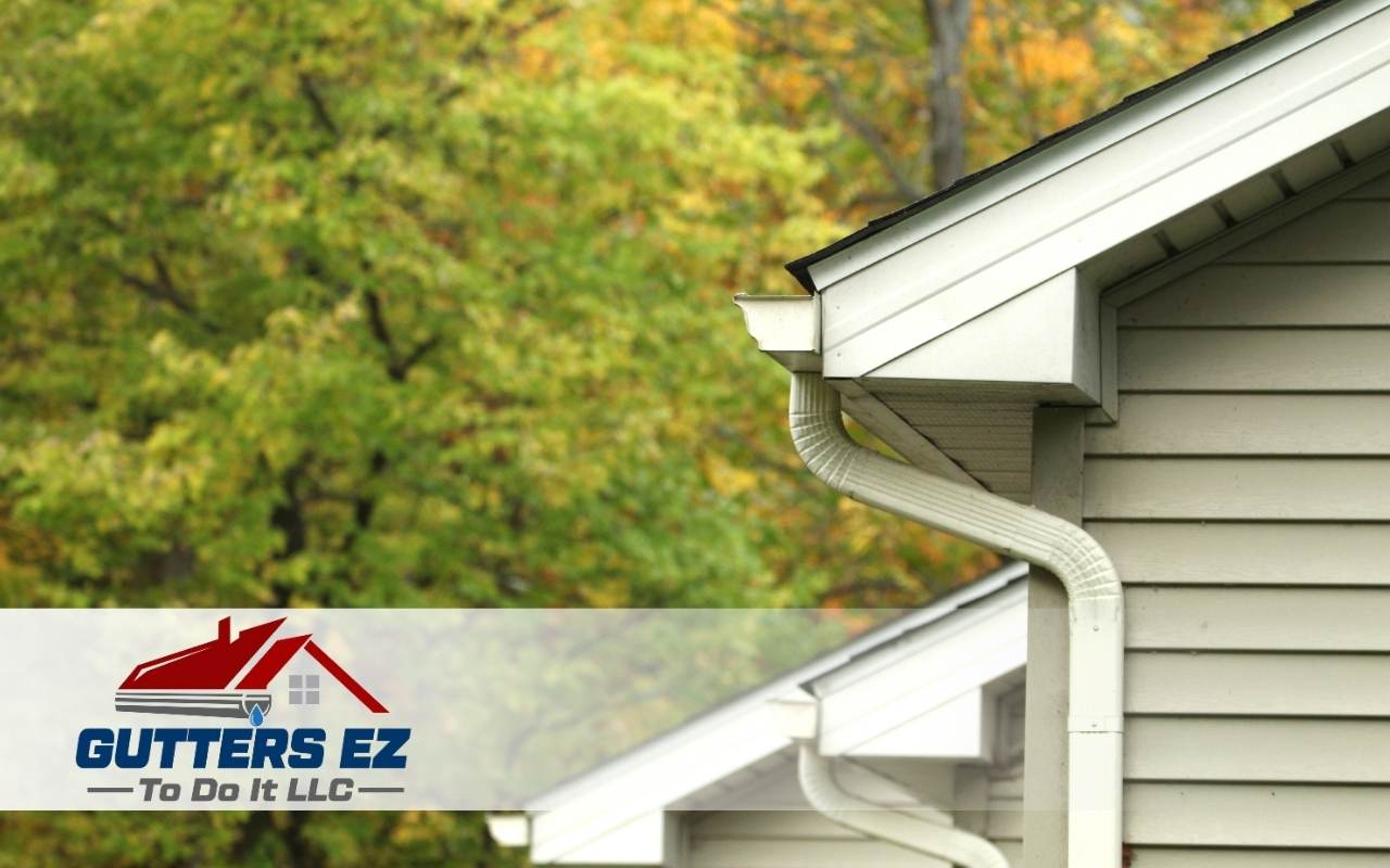 Mold and dark stains appearing near the roofline from water runoff