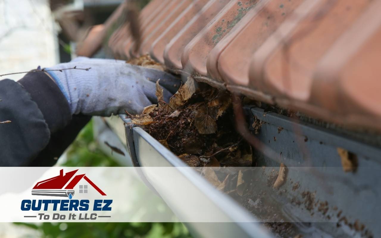 Homeowner cleaning and sealing copper gutters for maintenance