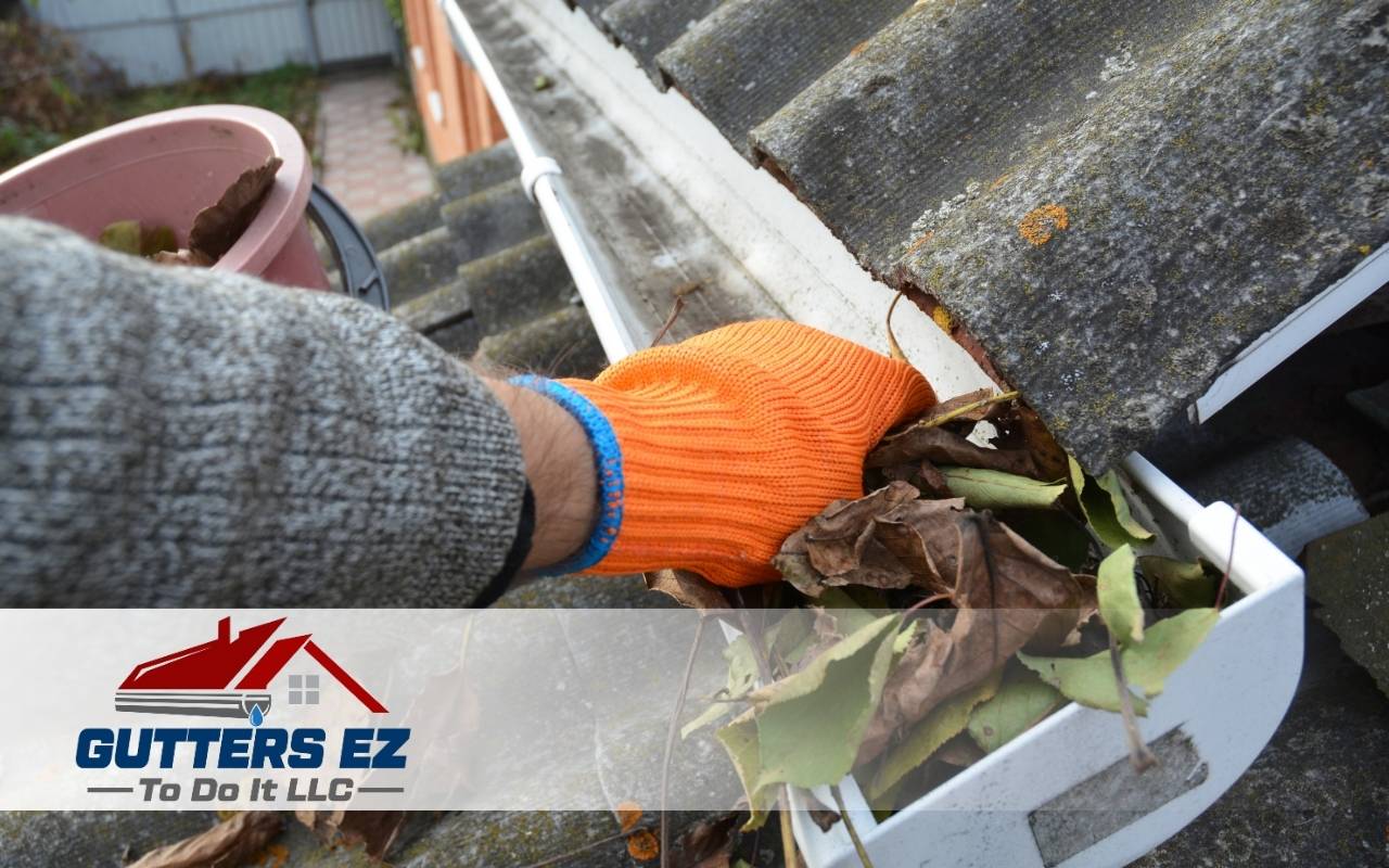 Homeowner learning how often to clean gutters Montgomery County PA