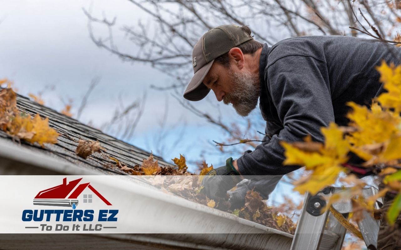 Worker replacing gutter hangers after finding gutter hanger replacement signs